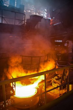 Metallurgical production. Red-hot metal in a vat.