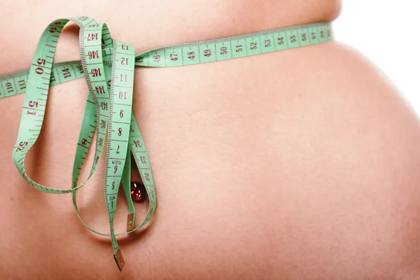 Woman slim stomach with measuring tape around it — Stock Photo, Image