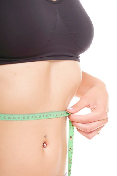 Woman slim stomach with measuring tape around it — Stock Photo, Image