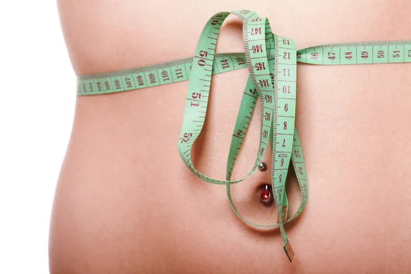 Woman slim stomach with measuring tape around it — Stock Photo, Image