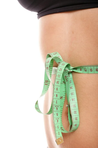 Woman slim stomach with measuring tape around it — Stock Photo, Image