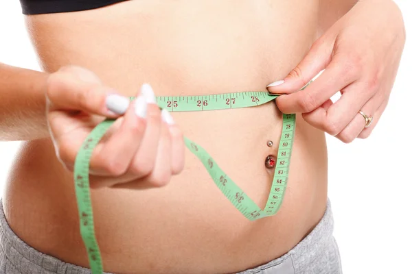 Woman slim stomach with measuring tape around it — Stock Photo, Image