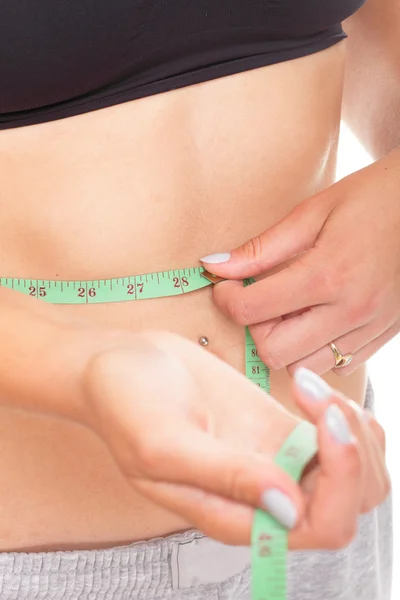 Woman slim stomach with measuring tape around it — Stock Photo, Image