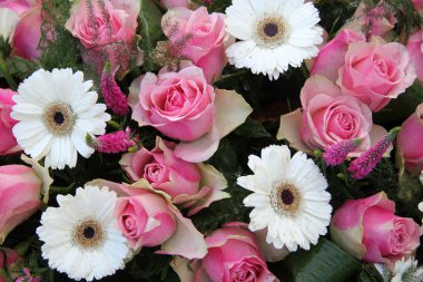 Pink roses, white gerberas in bridal arrangement