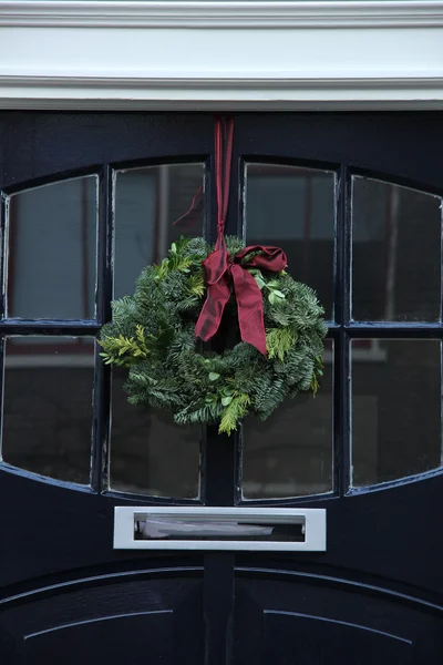 Christmas wreath on a door — Stock Photo, Image
