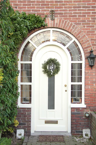 Christmas wreath on a door — Stock Photo, Image