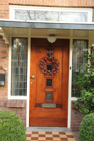 Christmas wreath on a door — Stock Photo, Image