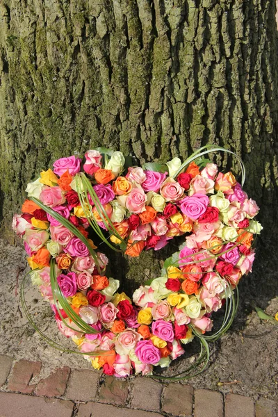 Heart shaped sympathy flowers — Stock Photo, Image