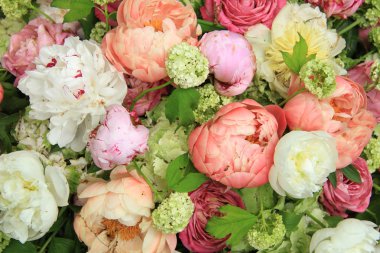 Peonies in a wedding arrangement