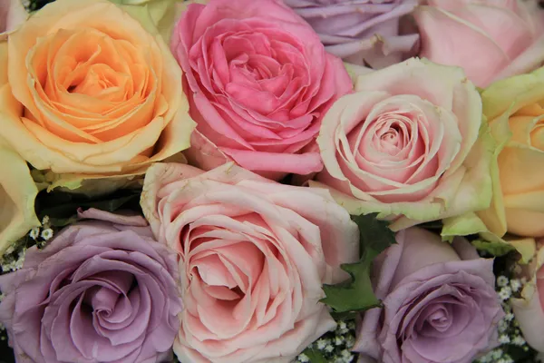 Pastel roses in bridal arrangement