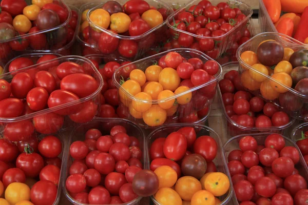 Small tomatoes at a market — Stock Photo, Image