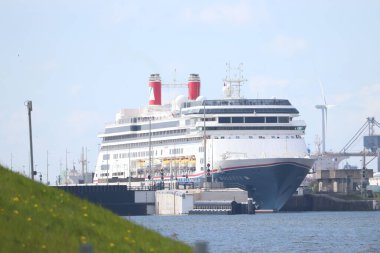 IJmuiden, the Netherlands - April, 30th 2022: MS Bolette cruise ship, operated by Fred Olsen Cruise lines, leaving Zeesluis IJmuiden, biggest sea lock in the world.
