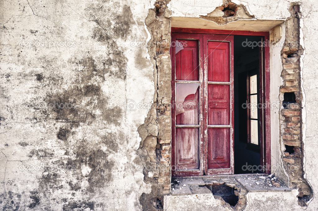 Old wall with a red window