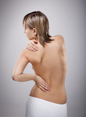 Woman massaging pain back clipart