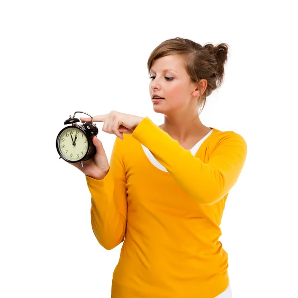 Young woman holding alrm clock isolated on white — Stock Photo, Image