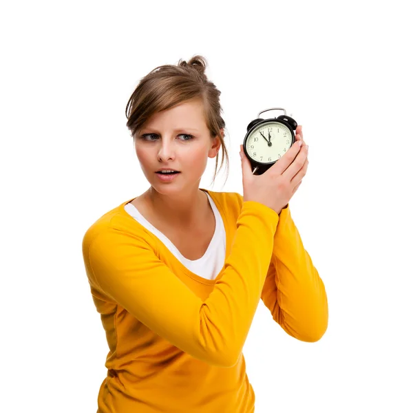 Mujer joven sosteniendo alrm reloj aislado en blanco —  Fotos de Stock