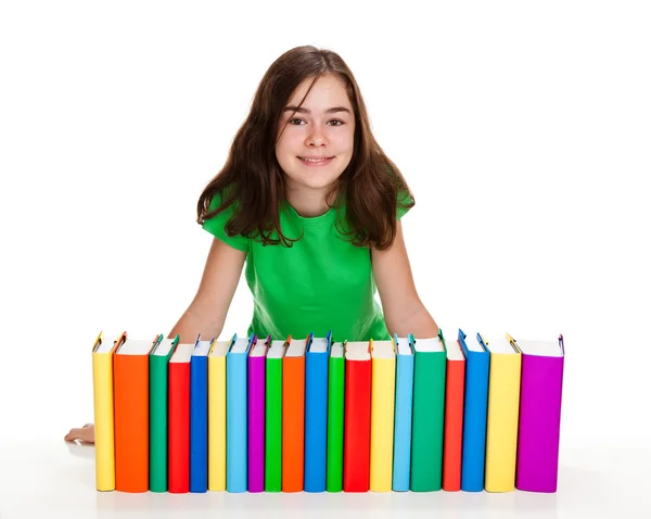 Menina por trás pilha de livros isolados no fundo branco — Fotografia de Stock