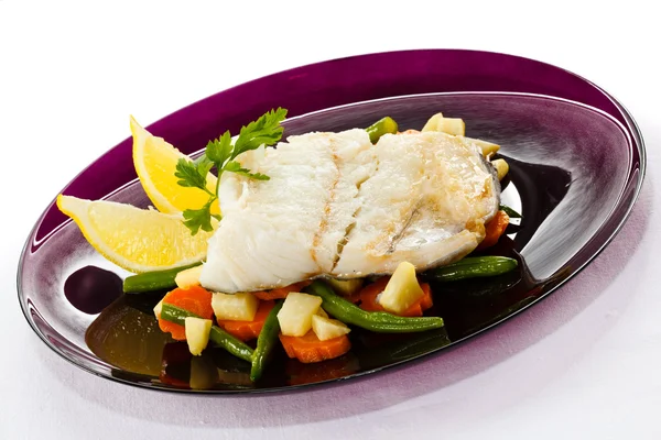 Fish dish - fish fillet in sauce and vegetables — Stock Photo, Image