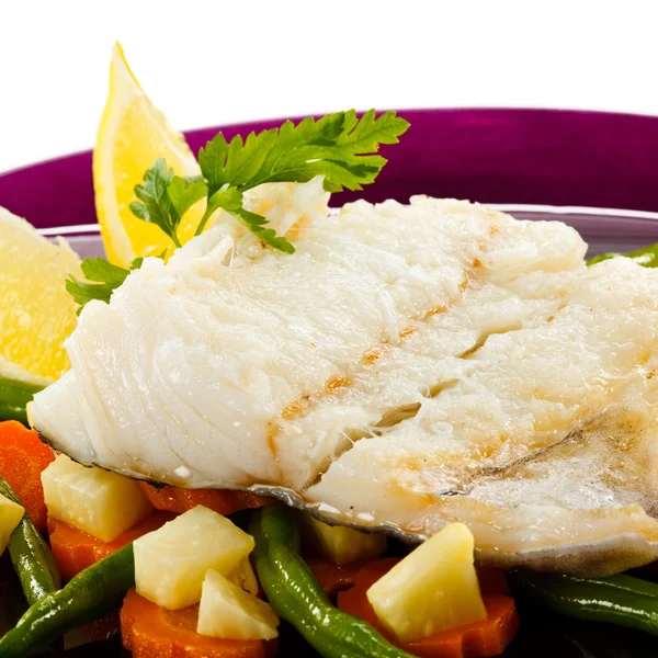 Fish dish - fish fillet in sauce and vegetables — Stock Photo, Image