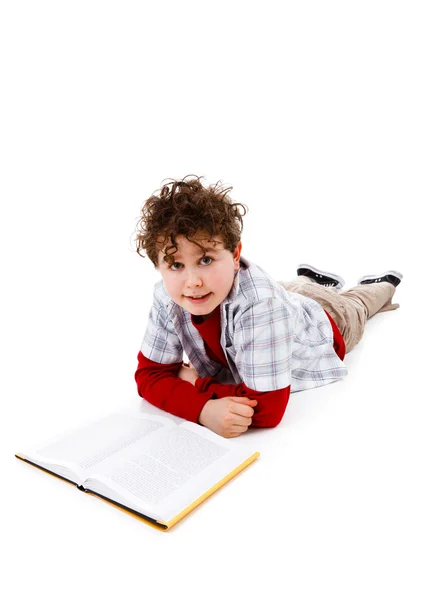 Boy lying and reading book — Stock Photo, Image