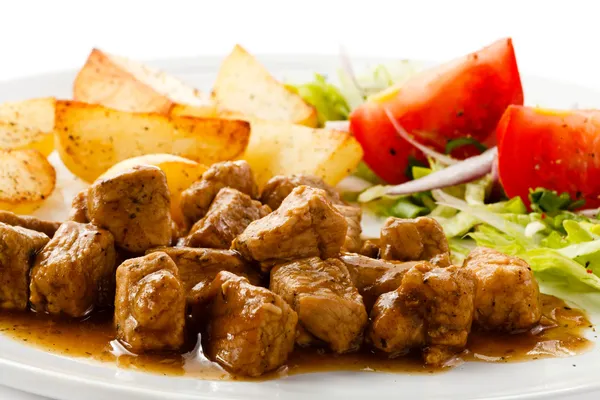 Goulash with roasted potatoes and vegetables — Stock Photo, Image