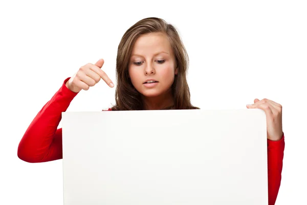 Young attractive girl behind empty board on white background — Stock Photo, Image