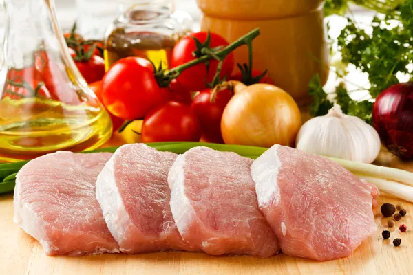 Fresh raw pork on cutting board — Stock Photo, Image