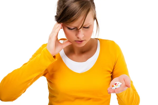 Suffering woman holding pills isolated on white background — Stock Photo, Image