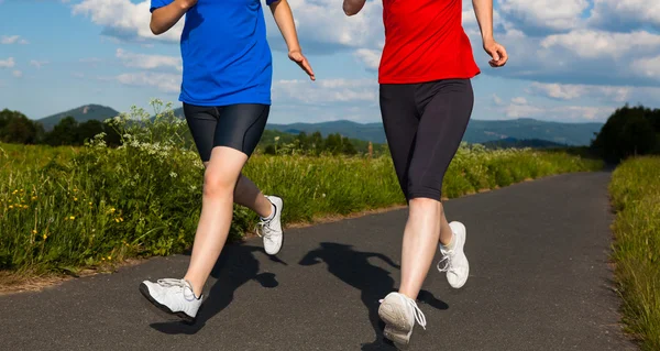 Women running, jumping outdoor — Stock Photo, Image