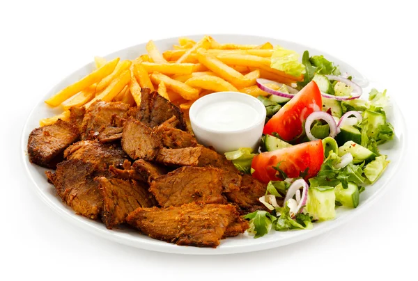 Grilled meat with French fries and vegetables — Stock Photo, Image