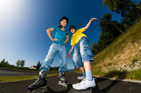 Active young - rollerblading, skateboarding — Stock Photo, Image