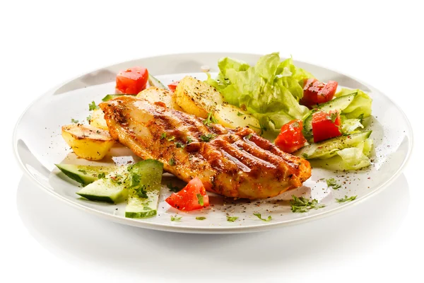 Grilled steaks, baked potatoes and vegetables — Stock Photo, Image