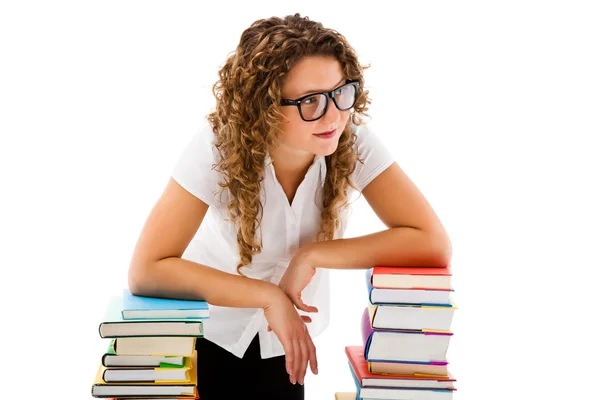 Jeune femme derrière pile de livres isolés sur fond blanc — Photo