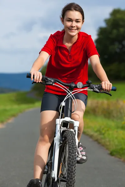 Healthy lifestyle - girl biking — Stock Photo, Image