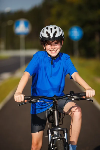 Healthy lifestyle - teenage boy biking — Stock Photo, Image