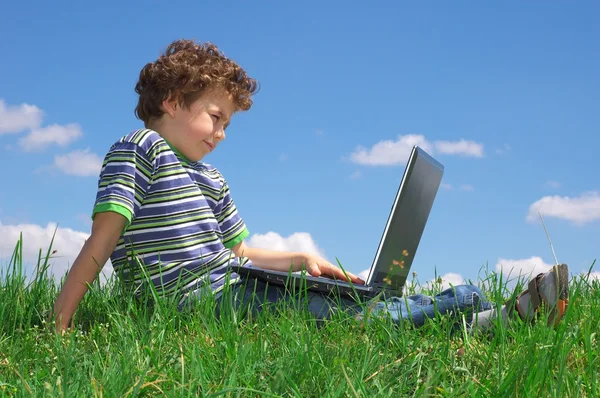 Boy with laptop Stock Picture