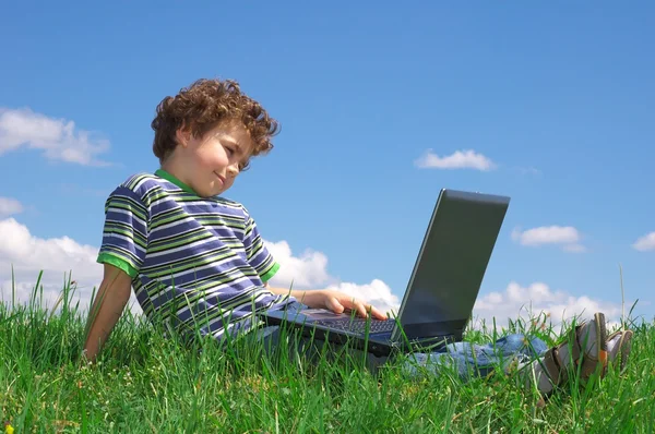 Boy with laptop Royalty Free Stock Photos