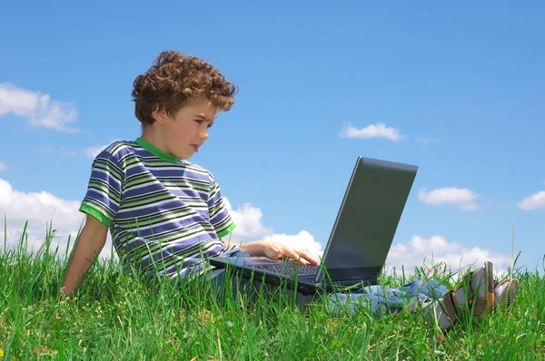 Boy with laptop Stock Image