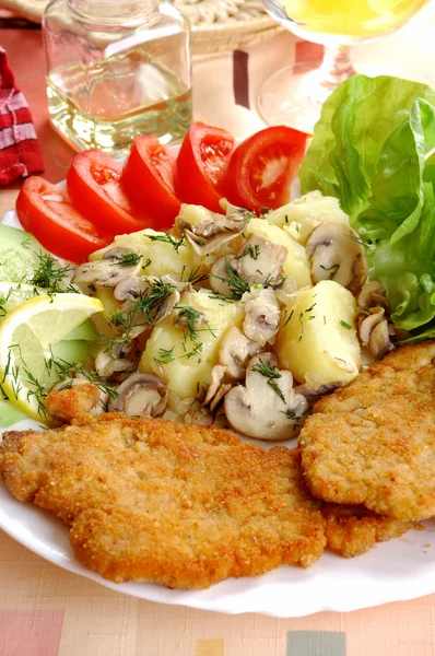 Cutlet with vegetables ,potatoes and champignons — Stock Photo, Image
