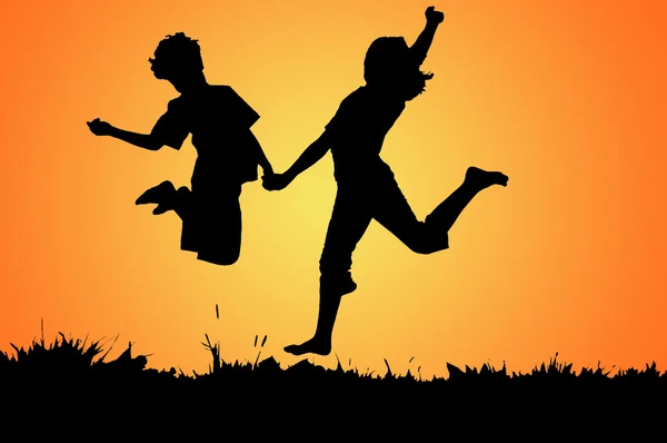 Boy and girl jumping — Stock Photo, Image