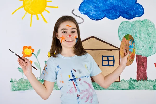 Girl painting on wall — Stock Photo, Image