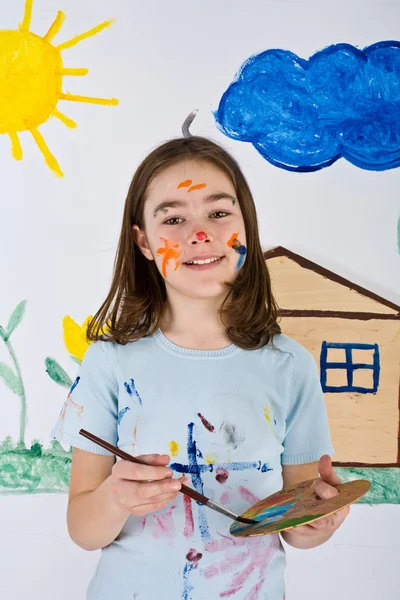 Girl painting on wall — Stock Photo, Image