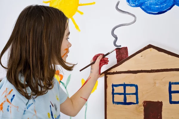 Girl painting on wall — Stock Photo, Image