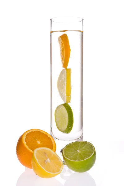 Lemon,orange and lime in glass of water — Stock Photo, Image