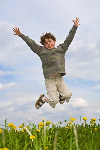 Boy jumping outdoors — Stock Photo, Image
