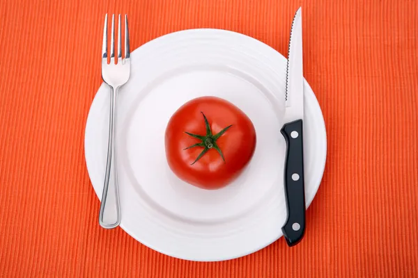 Empty plate on orange background — Stock Photo, Image