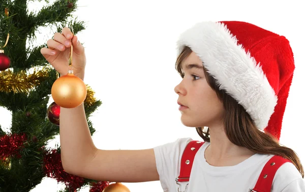 Jovem menina Santa decoração árvore de Natal — Fotografia de Stock