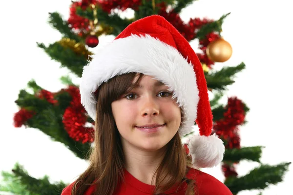 Młoda dziewczyna santa dekorowanie choinki — Zdjęcie stockowe