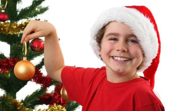 Jongen kerstboom versieren — Stockfoto