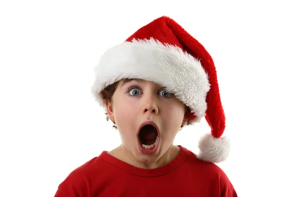 Zaskoczony chłopak przebrany za Świętego Mikołaja — Zdjęcie stockowe